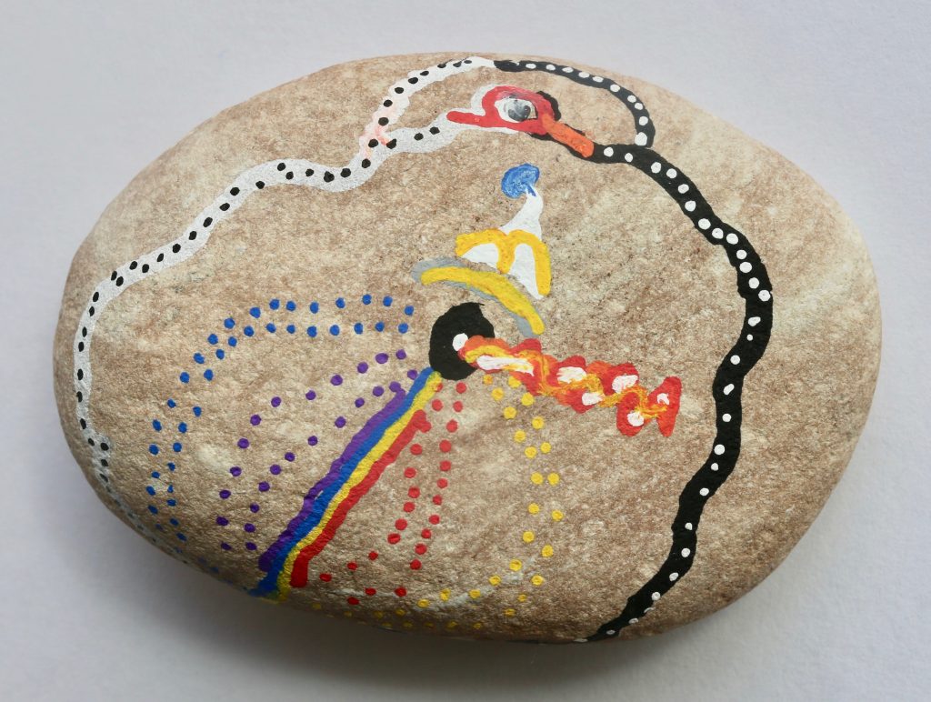 Kobe_11_Unspeakable_Acrylic Markers_Rock Painting "Unspeakable" a piece done in acrylic markers on a natural stone by Snow City student Kobe. The pieces shows an abstract design of multicolored dots, stripes and forms.